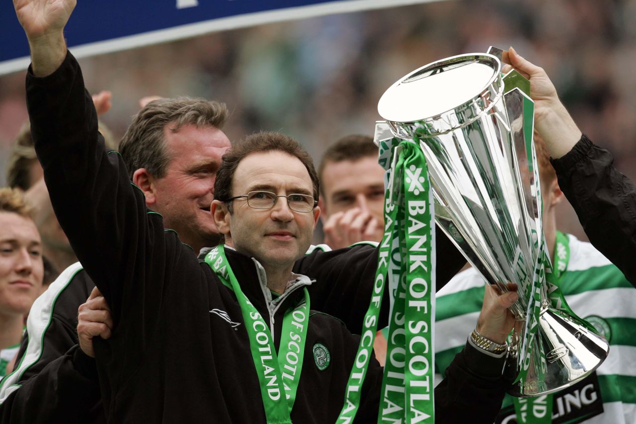 Celtic manager Martin O'Neill celebrates with the Scottish Premier League trophy, 2004