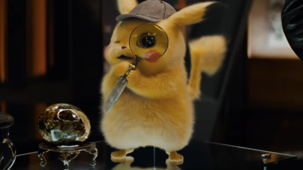 Detective Pikachu holds a magnifying glass to his eye in Pokémon Detective Pikachu.