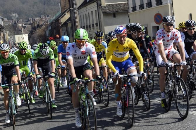 Netherlands' Moreno Hofland (C-L) wearing the best young's white jersey, France's Nacer Bouhanni (C) wearing the overall leader's yellow jersey, and France's Christophe Laborie (C-R) wearing the best climber's polka dot jersey take the start