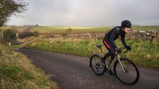 Image of cyclist riding a winter bike with mudguards/fender fitted