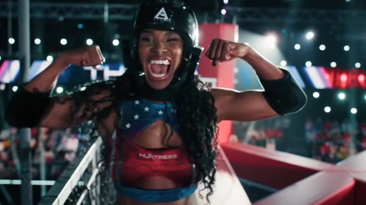 An American Gladiator showing off muscles.