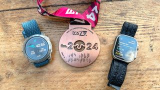 Apple Watch Ultra and Garmin Epix gen 2 with a london marathon medal