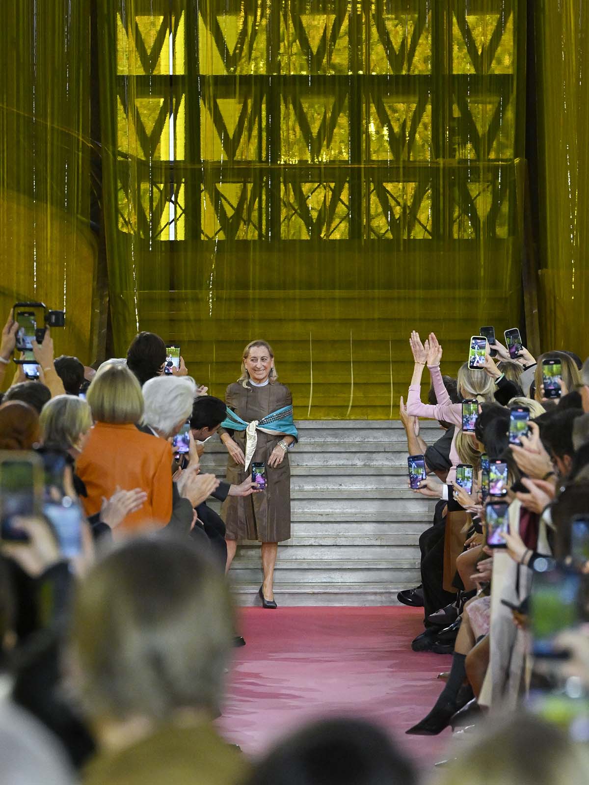 PARIS, FRANCE - OCTOBER 06: Fashion designer Miuccia Prada walks the runway during the Miu Miu Ready to Wear Spring/Summer 2026 fashion show as part of the Paris Fashion Week on October 6, 2025 in Paris, France.