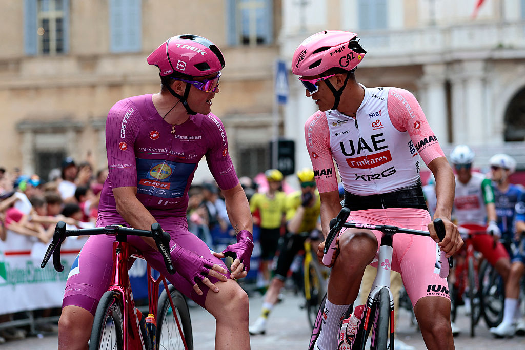 UAE Team Emirates XRG's Mexican rider Isaac Del Toro (R) chats with Cyclamen jersey Lidl-Trek's Danish rider Mads Pedersen before the 12th stage of the 108th Giro d'Italia cycling race of 172kms from Modena to Viadana on May 22, 2025. (Photo by Luca Bettini / AFP)