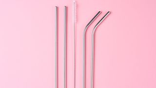 reusable straws on pink background