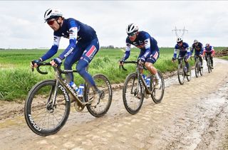 Kasper Asgreen leads his Soudal-QuickStep teammates on the Paris-Roubaix cobbles