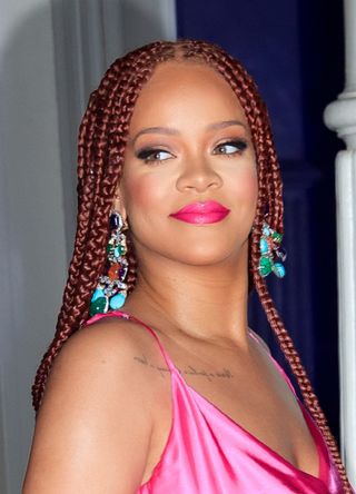 Rihanna wears a hot pink dress when arriving at a Fenty event on June 18, 2019 in New York City