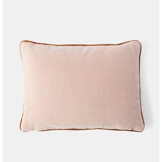pink velvet pillow with a contrast amber trim