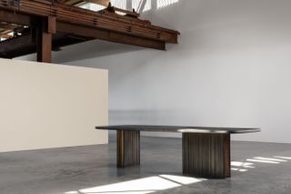 Large dining table in an industrial space