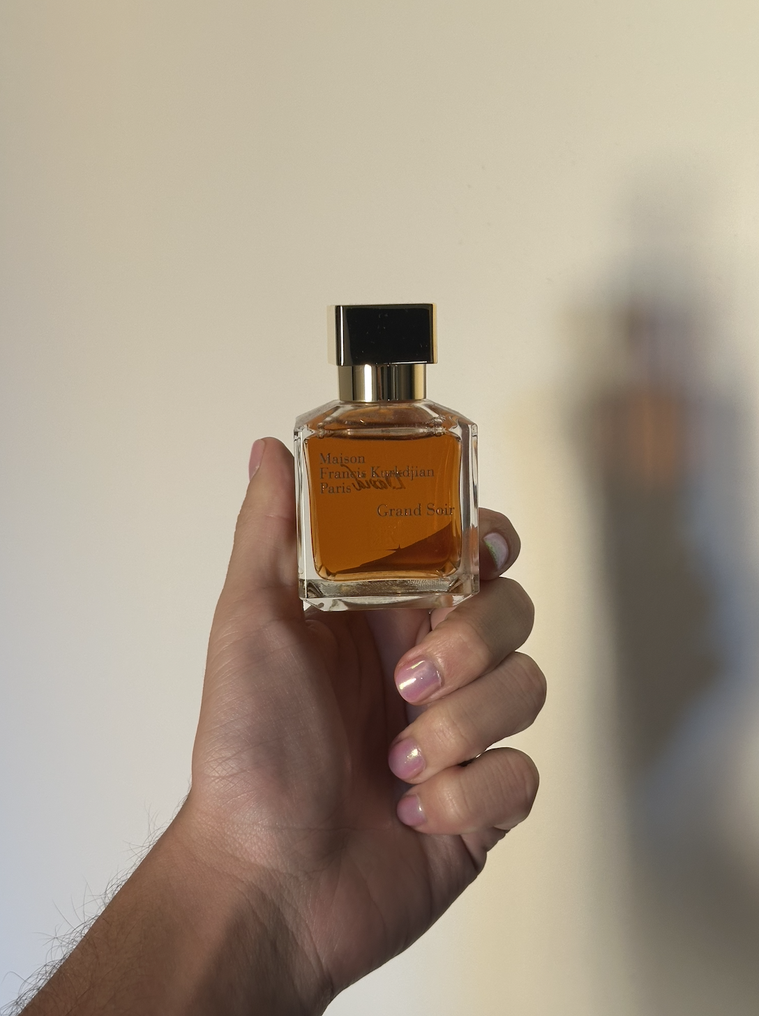 David Evan Ruff holding Maison Francis Kurkdjian Grand Soir Eau de Parfum