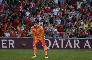 Unai Simon reacts after letting Pedri's back-pass slip through him for an own goal