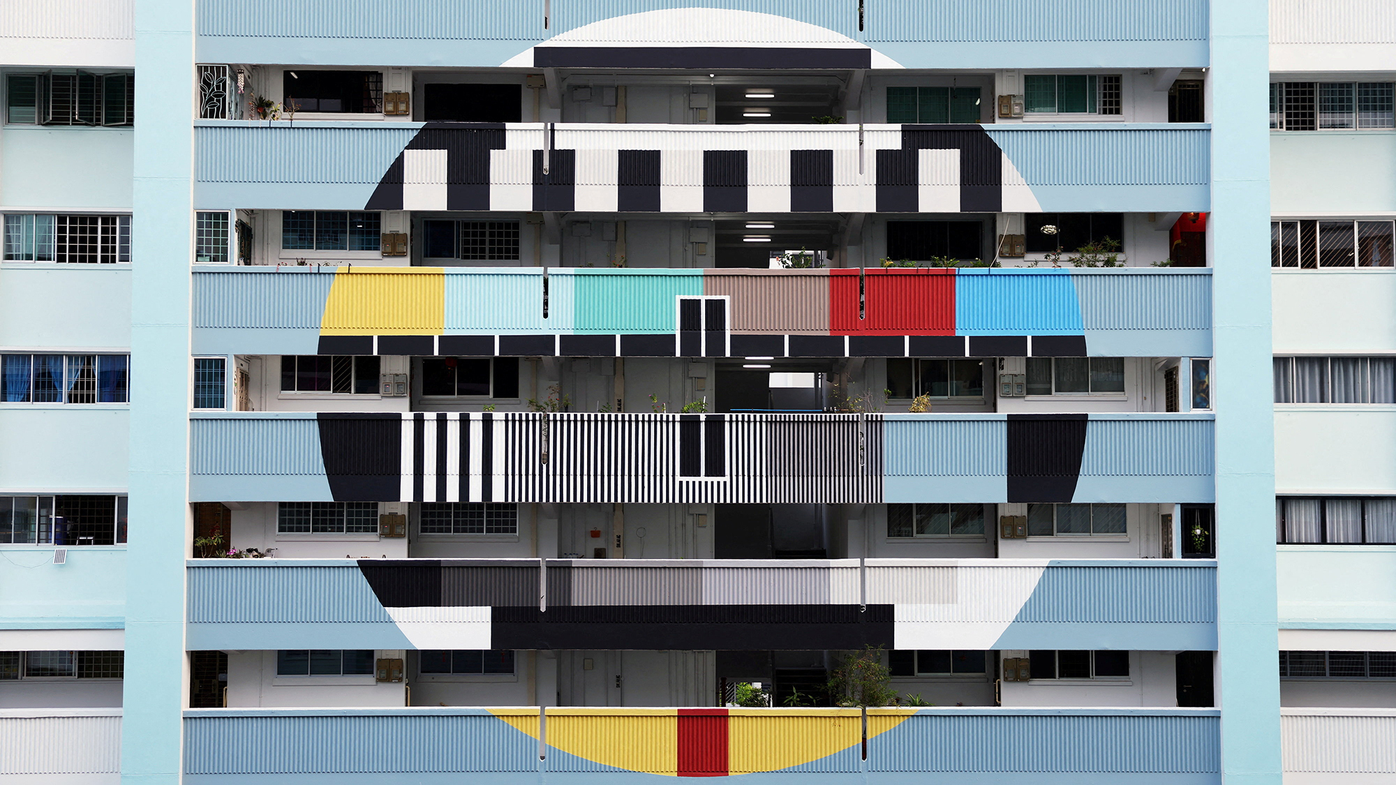 The facade of a housing estate is painted to resemble an old-fashioned television test pattern in Singapore