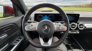 View from driver's seat of steering wheel and screens