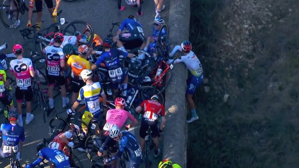 Valentin Ferron hung over a bridge after the huge crash during stage 2 of the Etoile de Besseges
