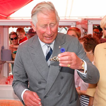 King Charles eating an oyster