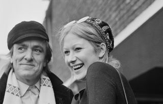 English actors Eric Porter (1928 - 1995) and Helen Mirren, of the Royal Shakespeare Company, at London Airport (now Heathrow), 4th January 1969. (Photo by Dove/Daily Express/Hulton Archive/Getty Images)
