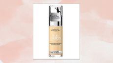 A close-up of the L'Oreal Paris True Match Liquid Foundation, Skincare Infused with Hyaluronic Acid/ in a pink watercolour paint-style template