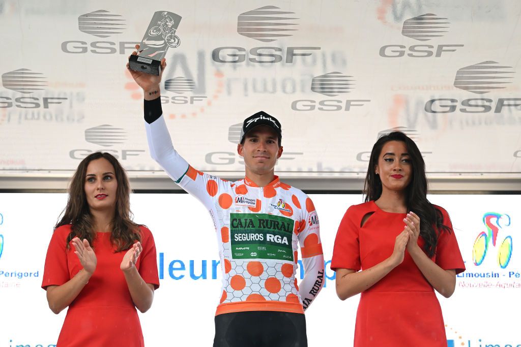 LA SOUTERRAINE FRANCE AUGUST 16 Joel Nicolau Beltran of Spain and Team Caja RuralSeguros RGA celebrates at podium as Polka Dot Mountain Jersey winner during the 55th Tour du Limousin Nouvelle Aquitaine 2022 Stage 1 a 1764km stage from VerneuilsurVienne to La Souterraine 385m TDL2022 on August 16 2022 in La Souterraine France Photo by Dario BelingheriGetty Images