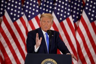 President Donald Trump speaks to supporters in the East Room of the White House on election night.