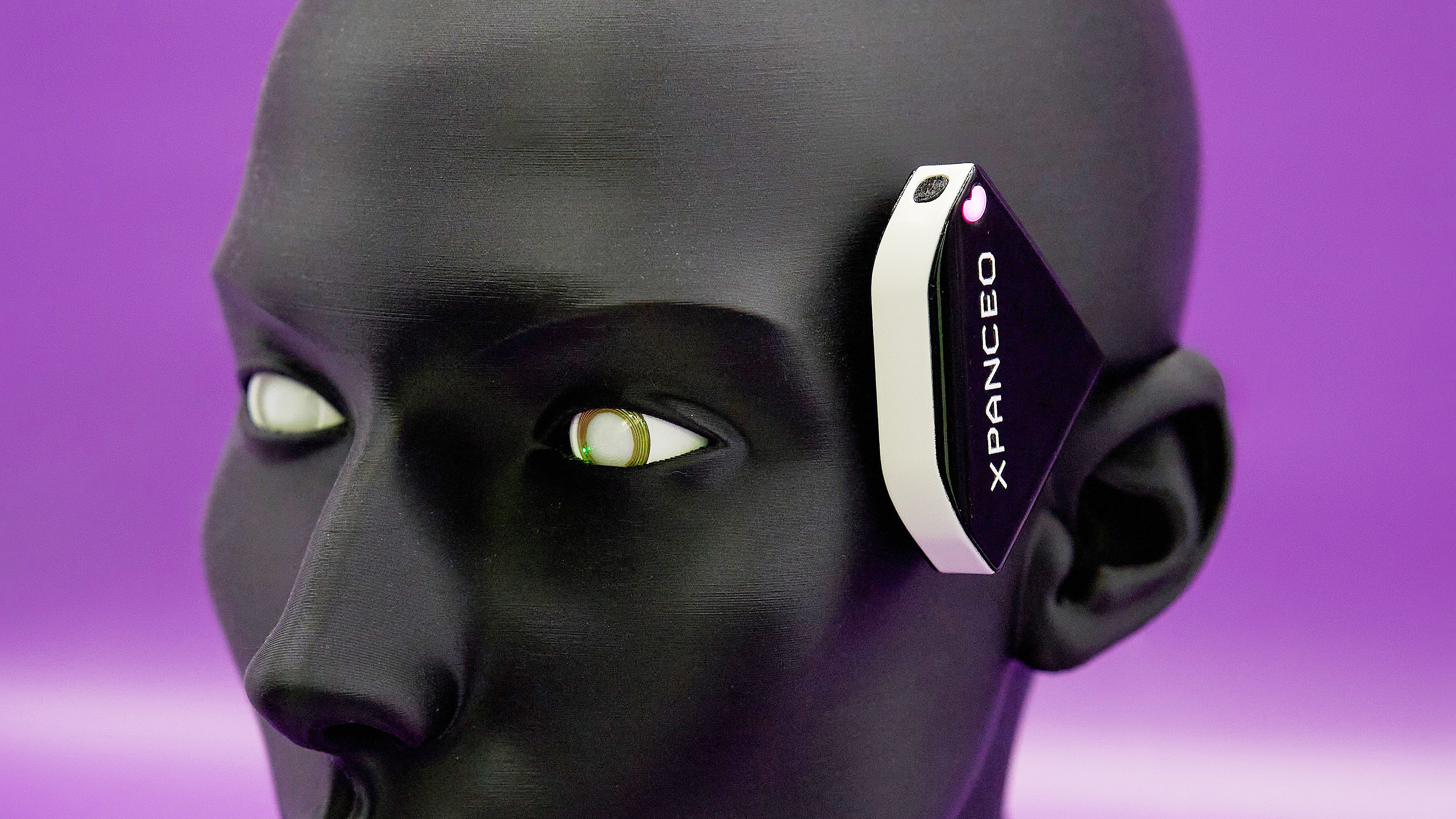 Close-up of Xpanceo smart contact lens prototype companion device which handles computation for the lenses