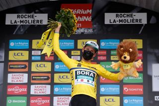 ROCHELAMOLIERE FRANCE JUNE 02 Lukas Pstlberger of Austria and Team Bora Hansgrohe Yellow Leader Jersey celebrates at podium during the 73rd Critrium du Dauphin 2021 Stage 4 a 164km Individual Time Trial stage from Firminy to RochelaMolire 585m Lion Mascot ITT UCIworldtour Dauphin dauphine on June 02 2021 in RochelaMoliere France Photo by Bas CzerwinskiGetty Images