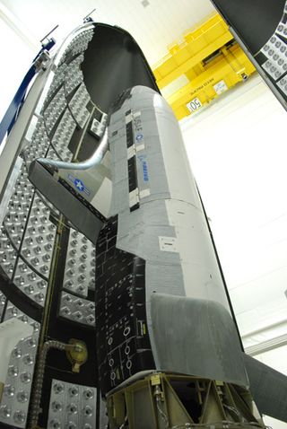 The second Boeing X-37B Orbital Test Vehicle, built for the U.S. Air Force, is shown here during encapsulation within the United Launch Alliance Atlas 5 rocket's 5-meter fairing at Astrotech in Titusville, Fla., on Feb. 8, 2011. The Air Force launched the new space plane from the nearby Cape Canaveral Air Force Station on March 5.