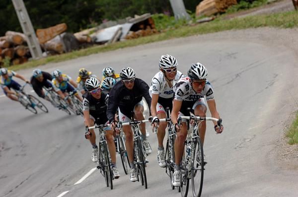 Team Saxo Bank riders head the peloton on the descent of the Col des Saisies.