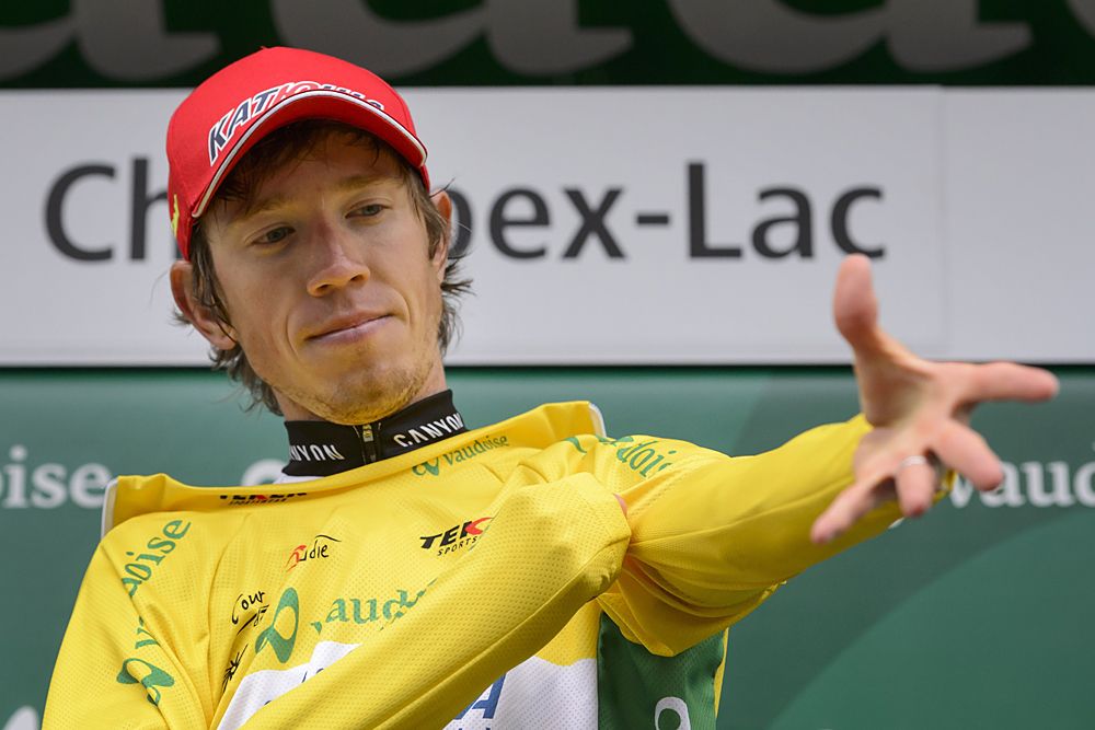 Ilnur Zakarin (Team Katusha) tries on the leader's jersey