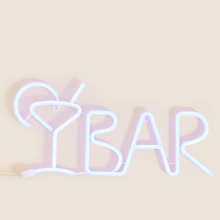 neon sign that says 'bar' with martini glass