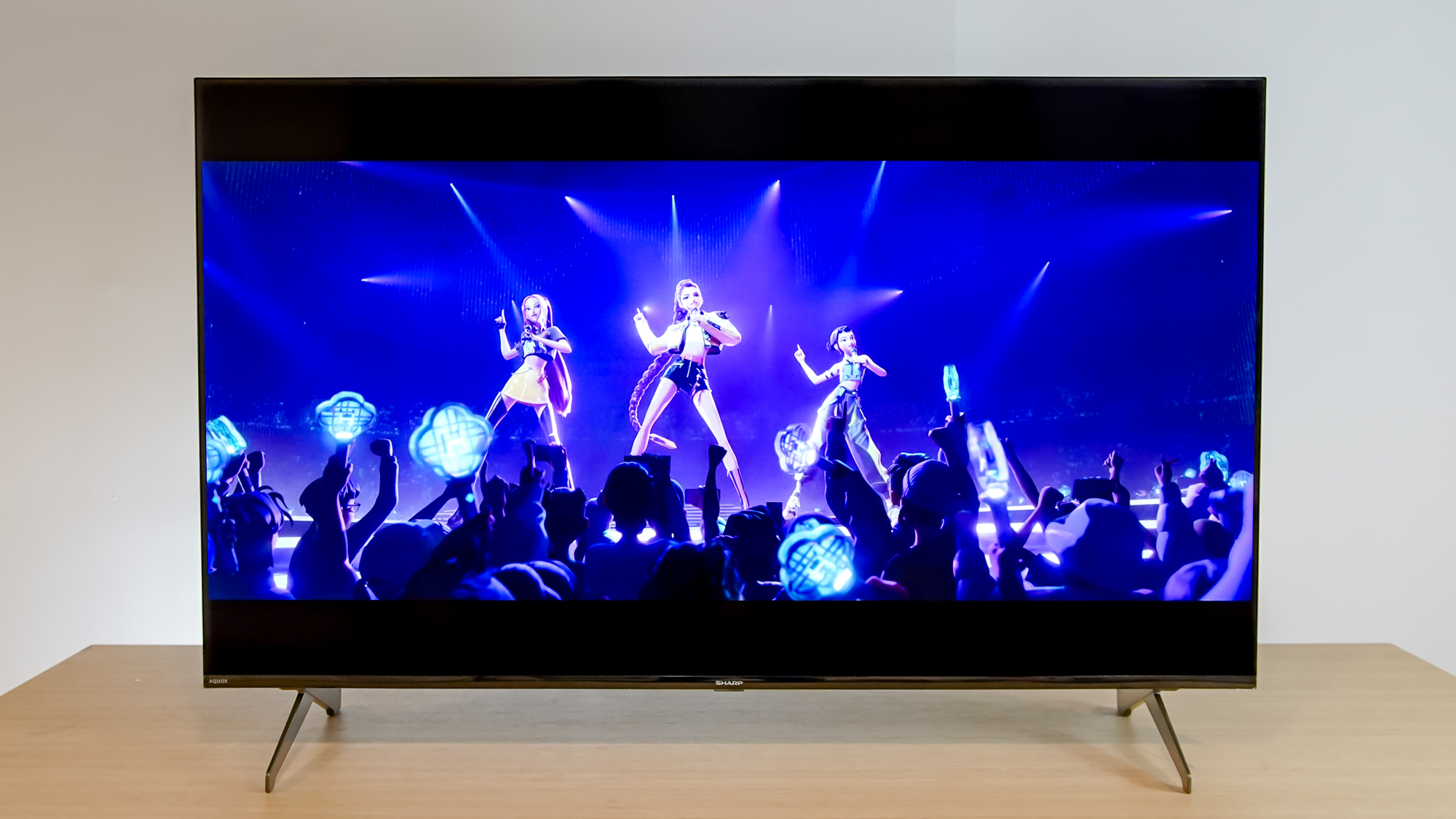 A Sharp Aquos QLED TV on a table