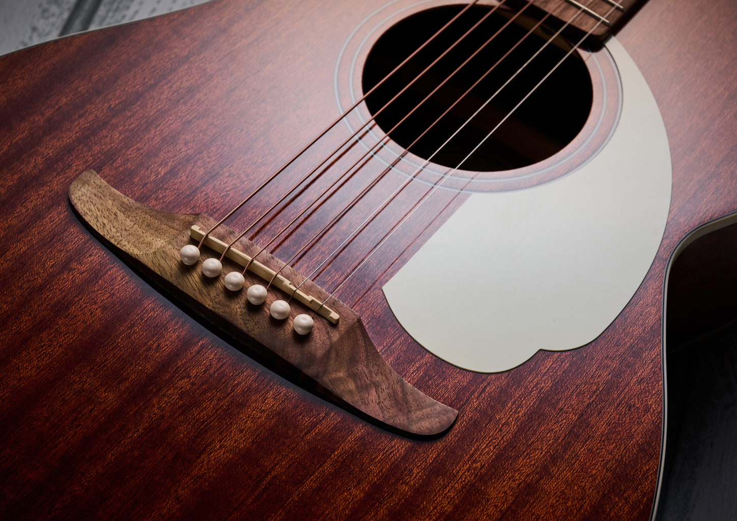 Close up of the bridge and pickguard on the Fender California Standard Monterey E acoustic guitar