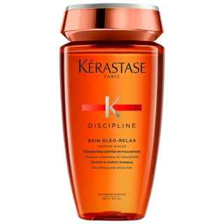 An orange bottle of Kerastase Discpline Bain Oleo-Relax shampoo