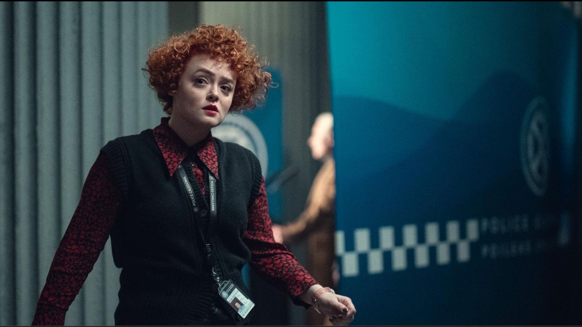 an image from Netflix show, Department Q showing Leah Byrne as a police detective in the police station