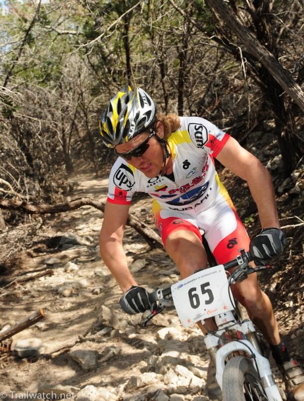 A rider takes on what looked like an old streambed