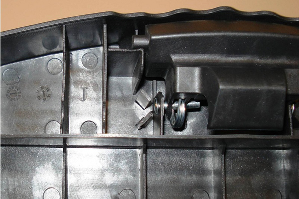 "J" is stamped on the underside of the top step, left of the locking mechanism