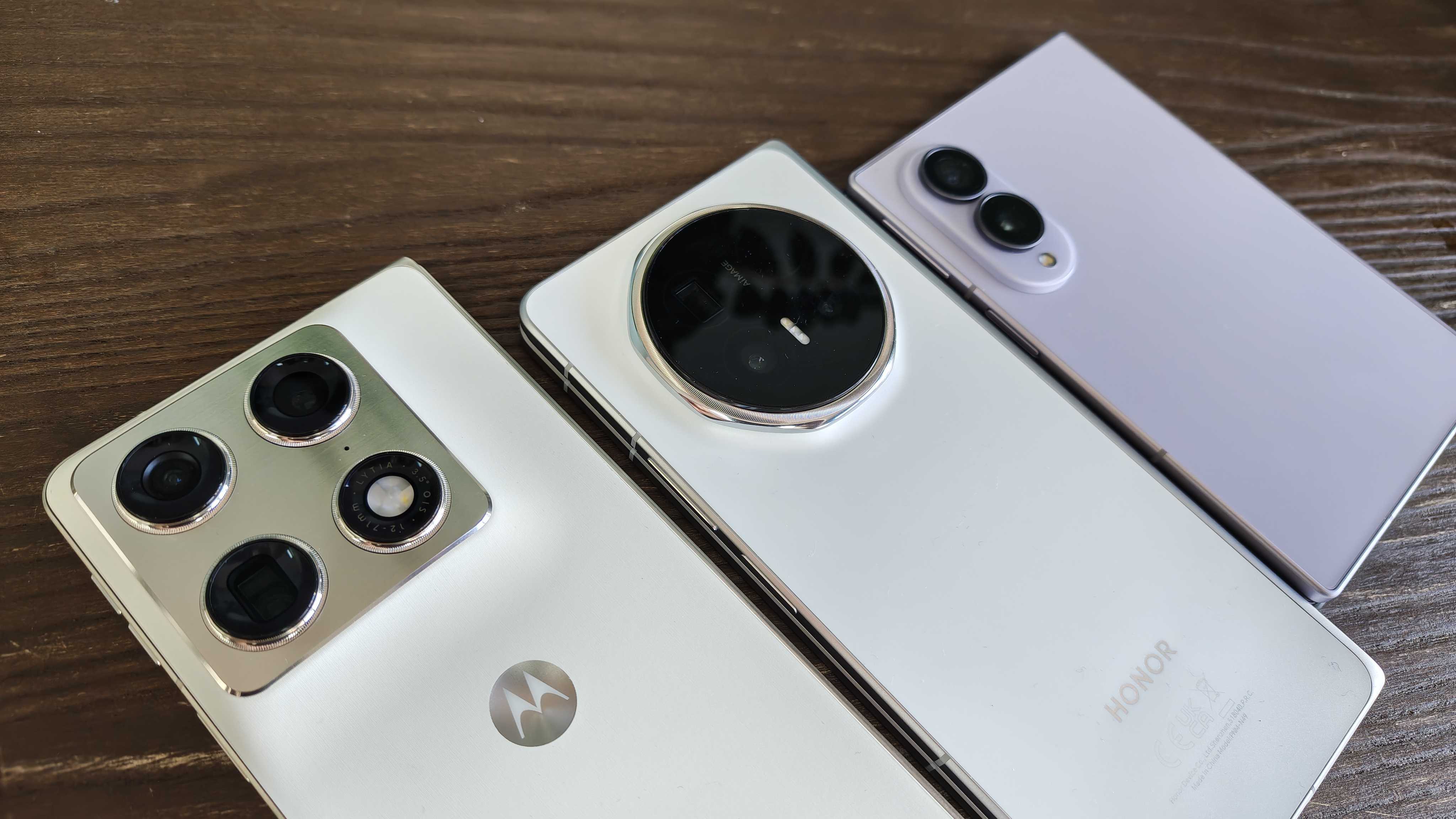 Three foldables from left to right, Motorola Razr Fold, Honor Magic V6 and Samsung Galaxy Z Fold 8