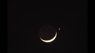 The planet Venus and the crescent moon are pictured on March 24, 2023 in Fuxin, Liaoning Province of China.