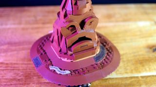 Lego Talking Sorting Hat on a wooden table, seen from above