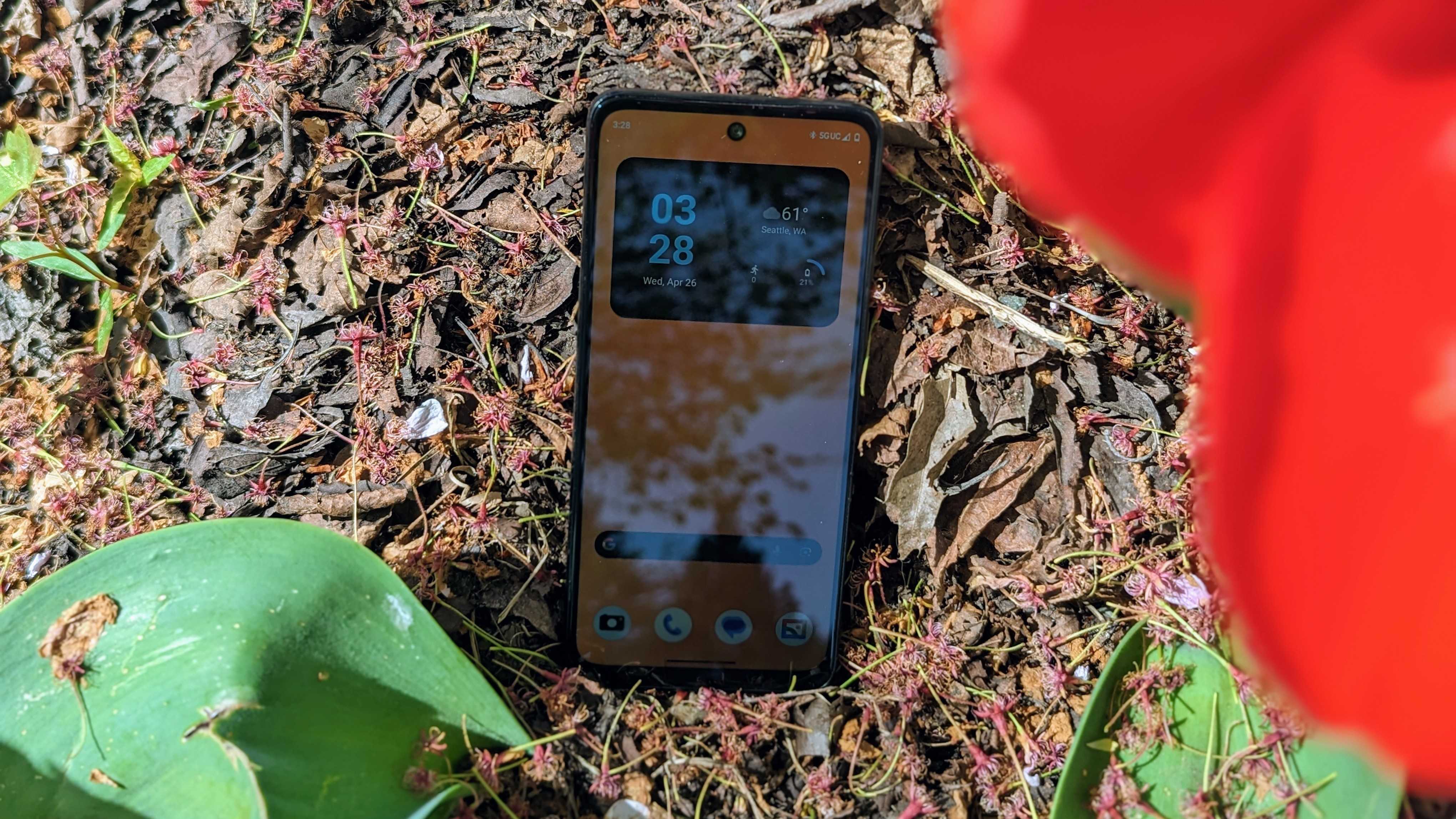 Moto G Power 5G outdoors next to a tree