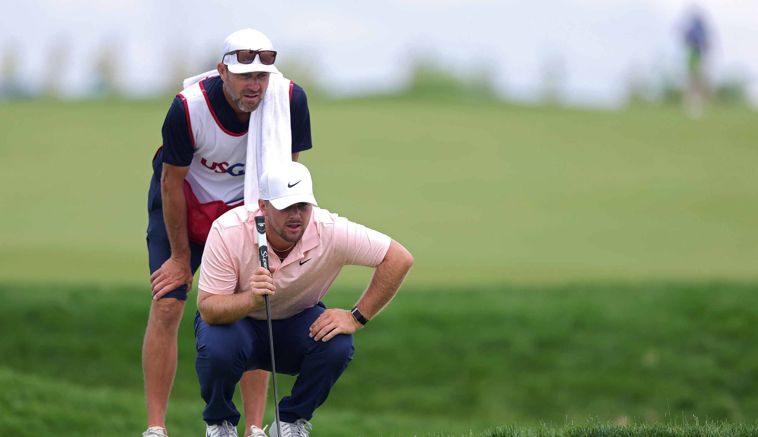 Chris Gotterup lines up a putt
