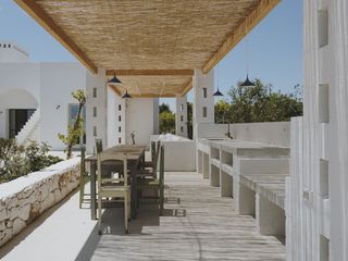 An outdoor area with a roof above the deck