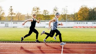 women-running-on-a-running-track-gettyimages
