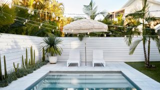 white painted fence around swimming pool