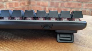 The USB C power port on the back of the HyperX Alloy Origins 60
