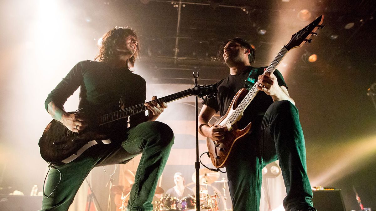 uitarists Mark Holcomb (L) and Misha Mansoor (R) of Periphery