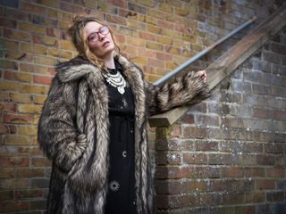 Hasselblad XCD 75P sample image of a woman wearing a fur coat in an urban environment