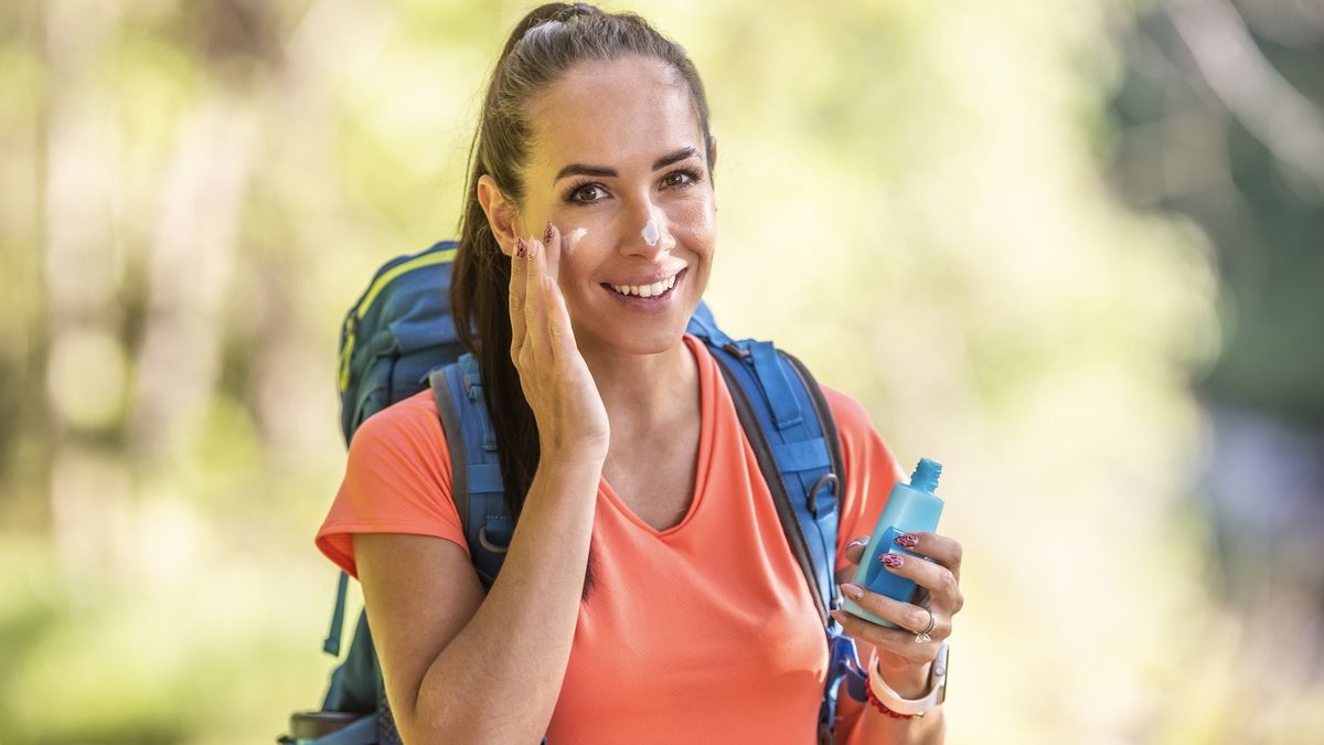 woman applying sun screen