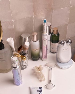 Flat lay of skincare products and tools.