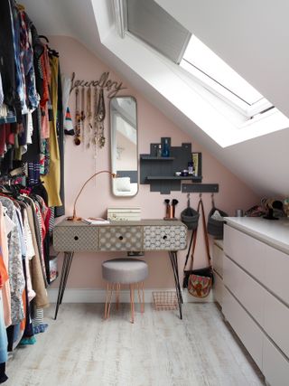 Jenny Weston loft: the dressing room is pink with a patterned dresser and open rails
