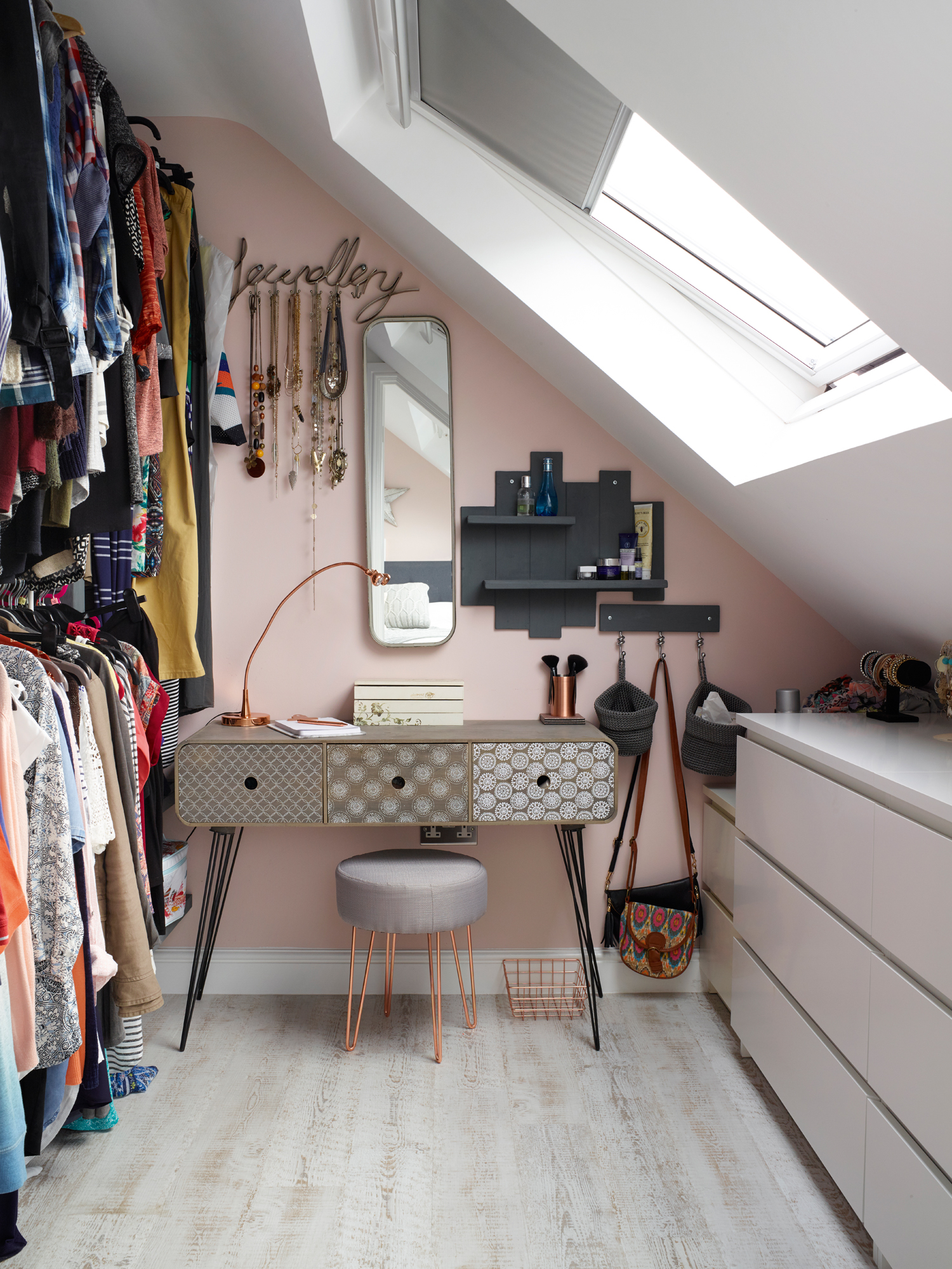 Jenny Weston loft: the dressing room is pink with a patterned dresser and open rails